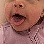 Evonn is registered to the contest to win money with this photo: baby, close_up, tongue_out, face, infant, purple_clothing, cute, expression, skin, person, child, playful, young, mouth, eyes, head, cheeks, indoors, soft_texture, apparel