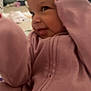 Evonn is registered to the contest to win money with this photo: baby, child, smiling, pink_clothing, indoor, face, person, young_child, cute, cozy, portrait, infant, hand, closeup, head, warm, casual, expression, soft, clothing