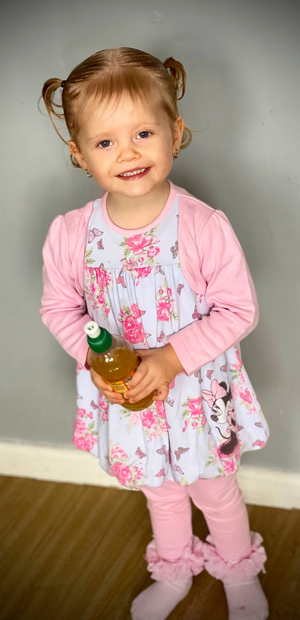 Evie-mae joined the competition — help win amazing prizes! baby, baby_toddler_clothing, bottle, child, face, finger, gesture, hairstyle, hand, happy, head, joy, neck, pattern, person, pink, skin, sleeve, smile, t_shirt