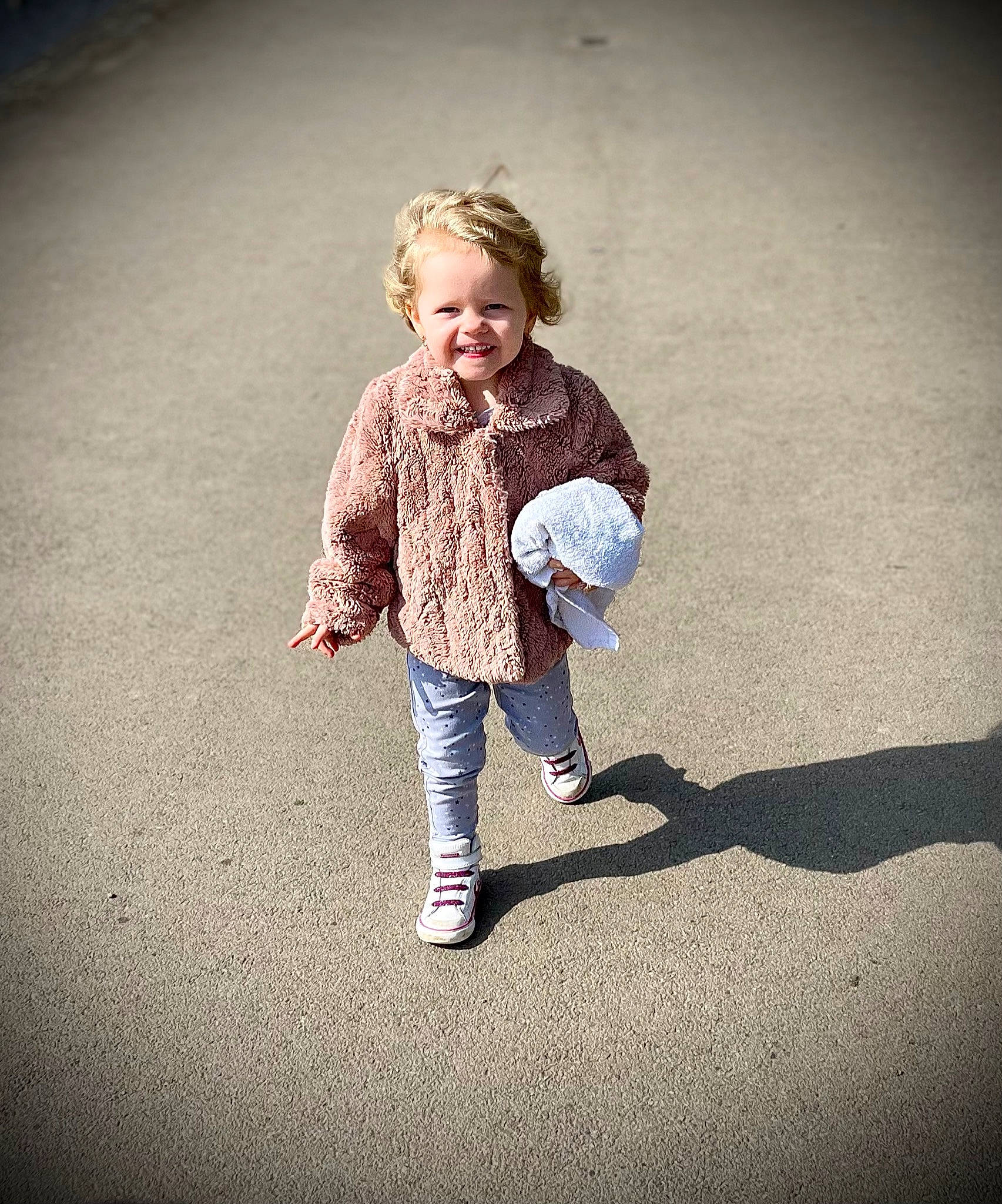 Evie-mae joined the competition — help win amazing prizes! asphalt, eye, flash_photography, flooring, gesture, grass, happy, human_body, joy, leg, leisure, people_in_nature, person, plant, road_surface, sleeve, smile, sneakers, standing, tints_and_shades