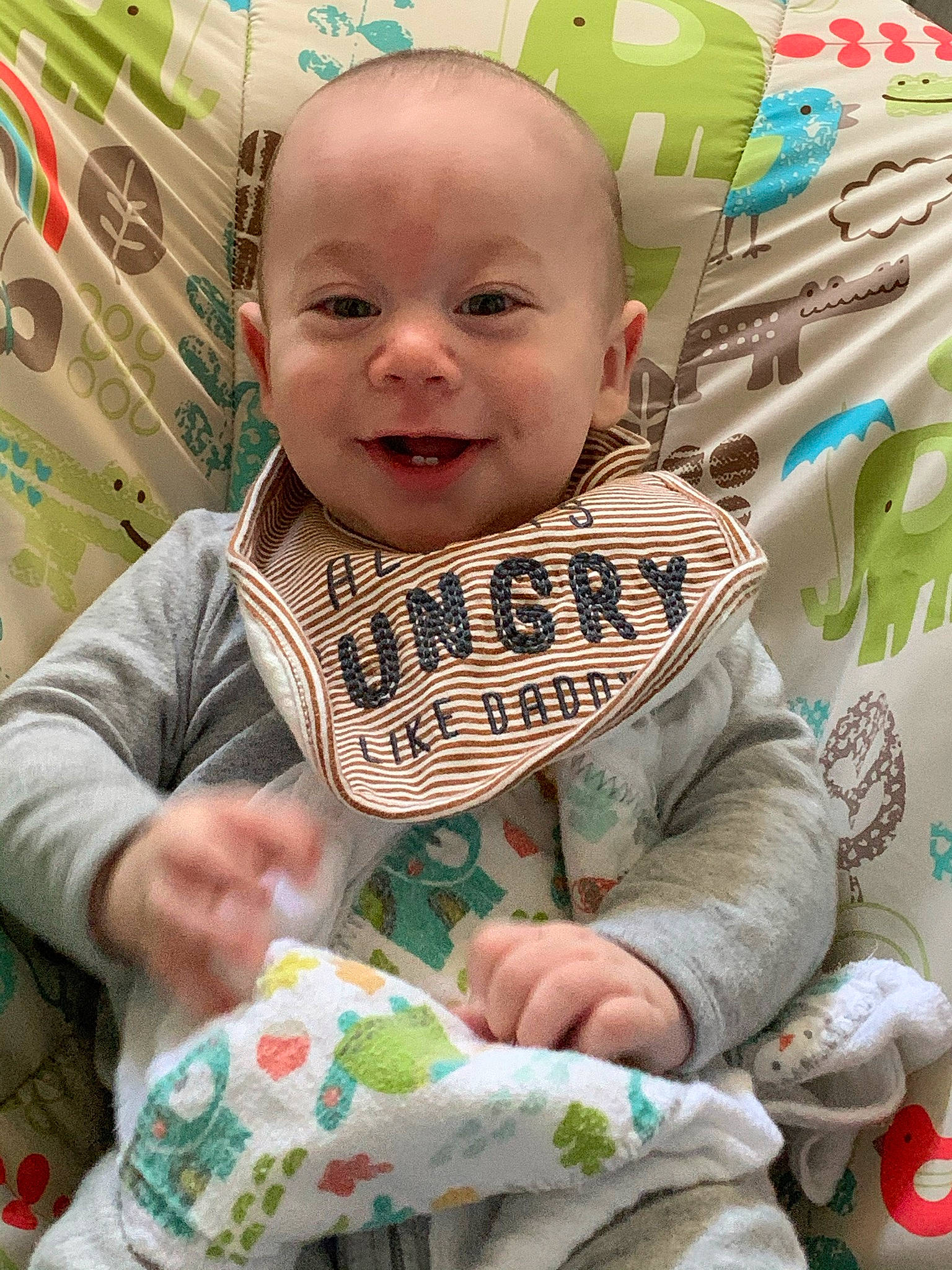 Ezra joined the competition — help win amazing prizes! baby, baby_products, baby_toddler_clothing, cheek, child, finger, fun, green, happy, head, linens, person, play, product, sitting, skin, sleeve, smile, t_shirt, textile