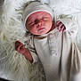 newborn, baby, sleeping, infant, knitwear, hat, blanket, fur, cozy, soft_texture, peaceful, portrait, child, indoors, cute, resting, sleep, small_hands, clothing, warm