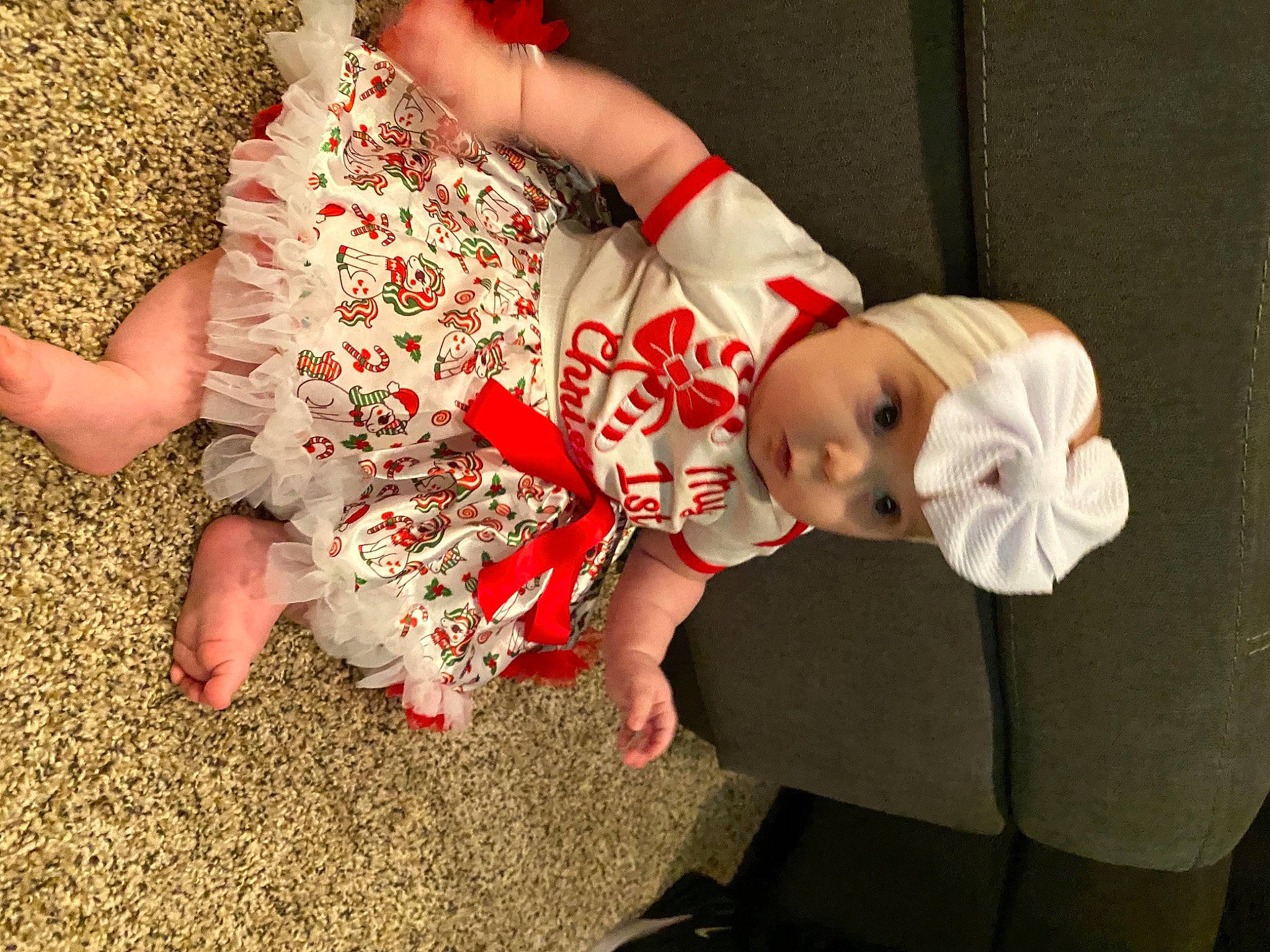 Alayah is registered to the contest to win money with this photo: baby, baby_toddler_clothing, carmine, child, doll, dress, fawn, finger, flooring, foot, fun, gesture, grass, happy, headwear, human_leg, person, sleeve, thigh, thumb