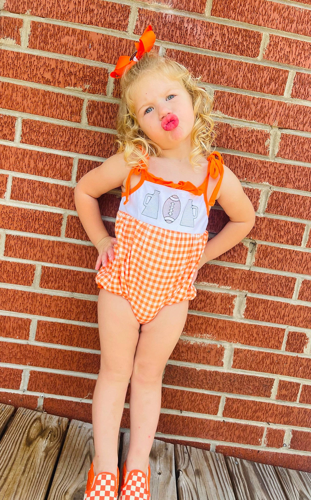 Hadleigh joined the competition — help win amazing prizes! baby_toddler_clothing, beauty, blond, brick, brickwork, dress, happy, human_leg, knee, leg, lip, magenta, orange, pattern, person, pink, red, shorts, skin, thigh