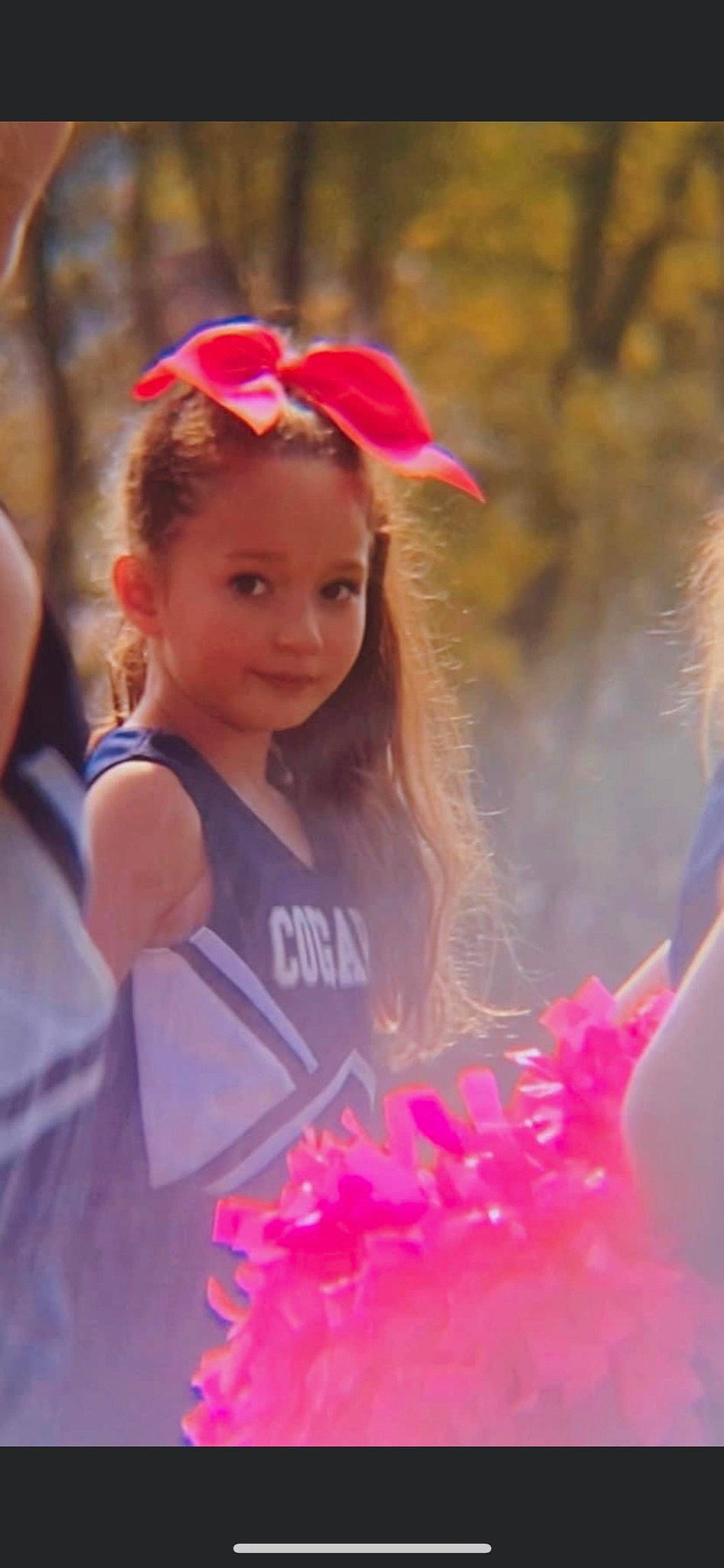 Mackenzie is registered to the contest to win money with this photo: blond, cap, child, event, fashion_accessory, fun, grass, happy, headgear, jewellery, leisure, lip, magenta, party_supply, person, petal, pink, recreation, red, spring