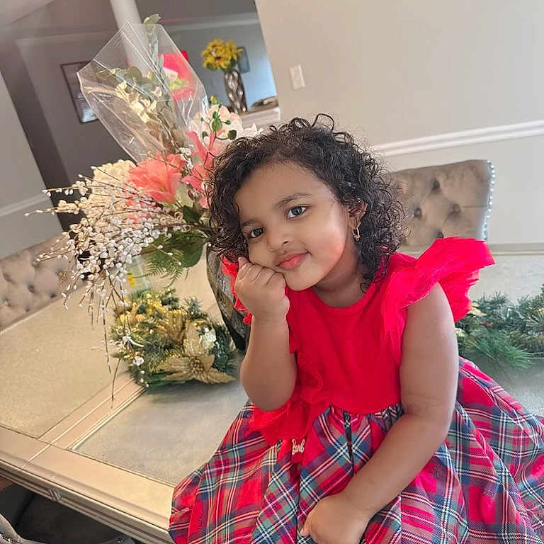 Arsema is registered to the contest to win money with this photo: blackhair, child, curlyhair, face, female, flower, flowerarrangement, flowerbouquet, furniture, girl, hair, happy, head, ikebana, person, photography, plant, portrait, pottedplant, table