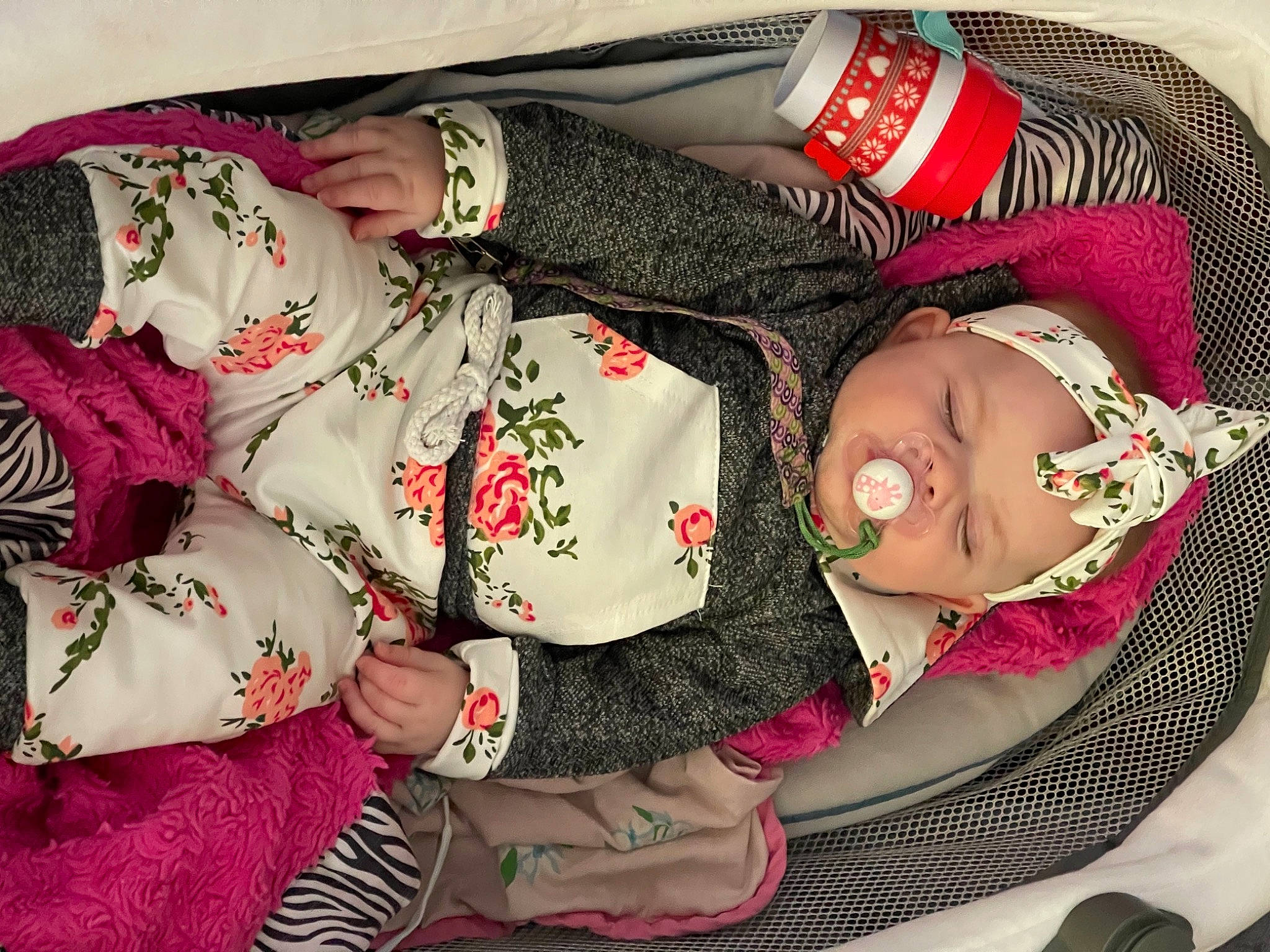 Amaya joined the competition — help win amazing prizes! baby, baby_toddler_clothing, carmine, child, comfort, creative_arts, fashion_accessory, flesh, happy, hat, headwear, lap, pattern, person, rose, sitting, sleeve, sun_hat, thigh, toddler