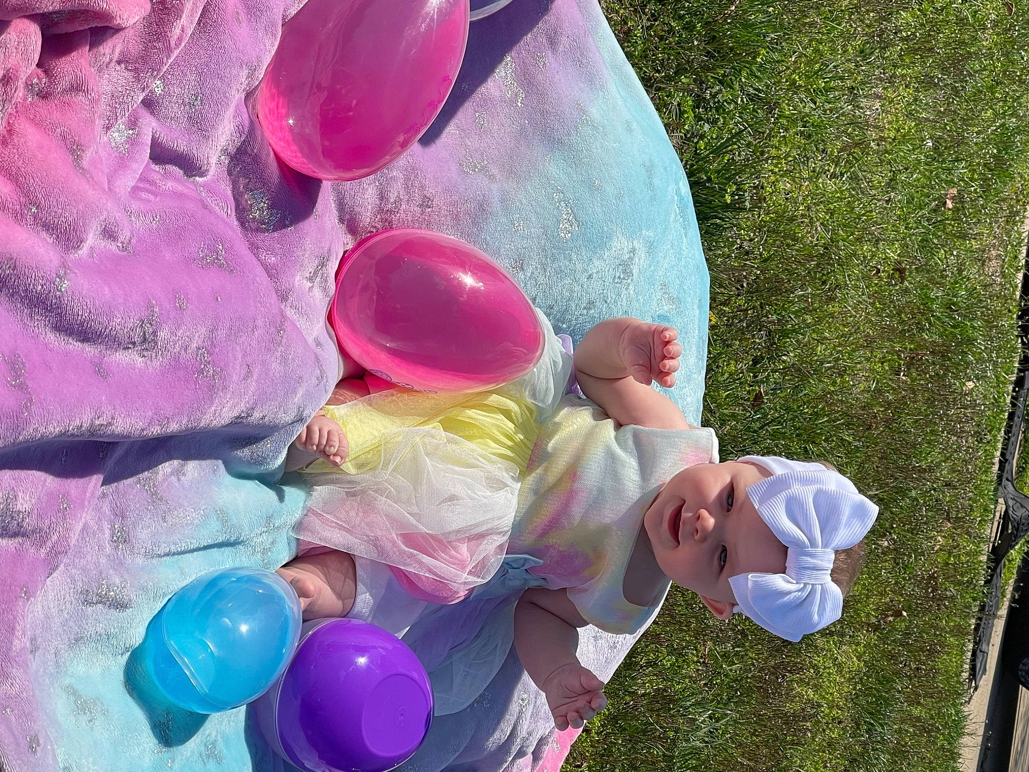 Amaya is registered to the contest to win money with this photo: baby, balloon, child, circle, event, fun, grass, happy, headwear, leisure, light, magenta, party_supply, people_in_nature, person, photograph, pink, play, recreation, toddler