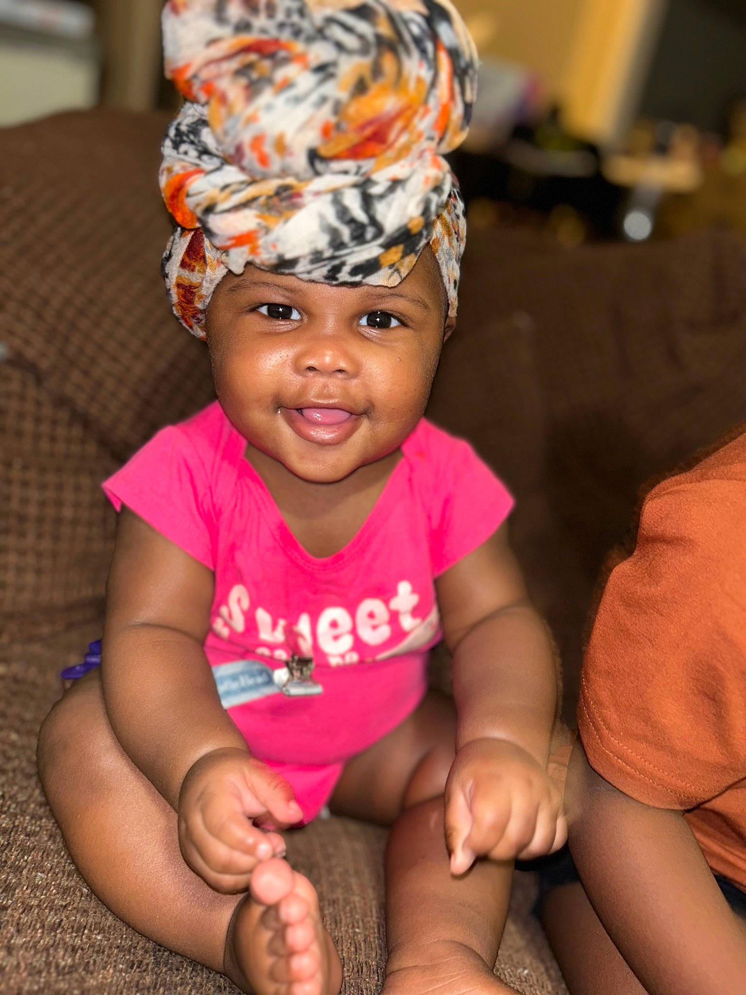 Armani is registered to the contest to win money with this photo: baby, baby_toddler_clothing, cap, child, costume_hat, event, fashion_accessory, fun, happy, headband, headpiece, headwear, leisure, magenta, party, party_supply, person, pink, smile, thumb