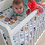Sebastian Milan participe au concours pour gagner de l'argent avec cette photo : baby, crib, tummy_time, plush_toy, animal_print, bedding, floor, wooden_floor, infant, child, cute, white_crib, indoor, playtime, soft_toy, pacifier, colorful, young_child, bed, person
