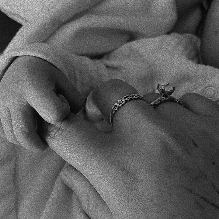 Ale is registered to the contest to win money with this photo: adult_hand, baby_hand, black_and_white, blanket, bond, care, close_up, comfort, connection, family, fingers, gentle, intimacy, love, newborn, ring, skin, soft, touch, wrapping