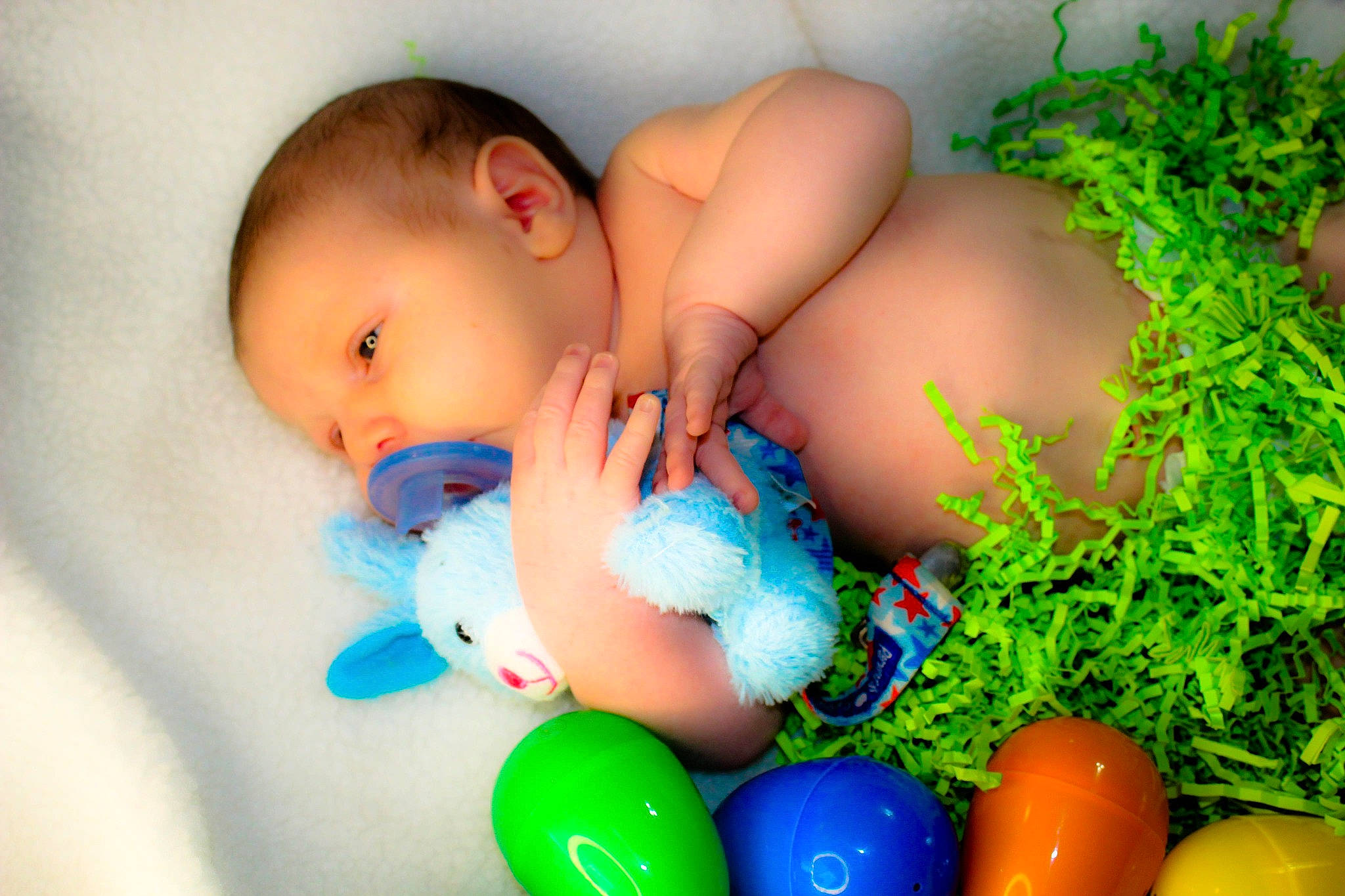 Corbin is registered to the contest to win money with this photo: abdomen, baby, baby_products, basket, child, easter, easter_egg, egg, grass, happy, herb, leisure, linens, people_in_nature, person, plant, product, skin, toddler, toy