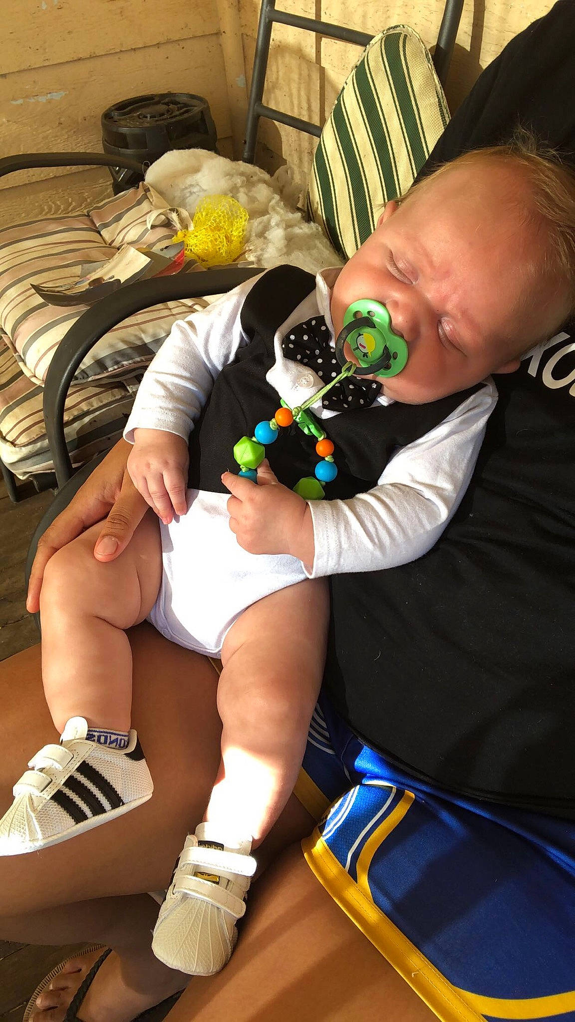 Buddy is registered to the contest to win money with this photo: baby, child, comfort, event, finger, fun, hand, human_leg, joint, knee, leg, leisure, muscle, nail, person, recreation, shorts, sitting, sock, thigh