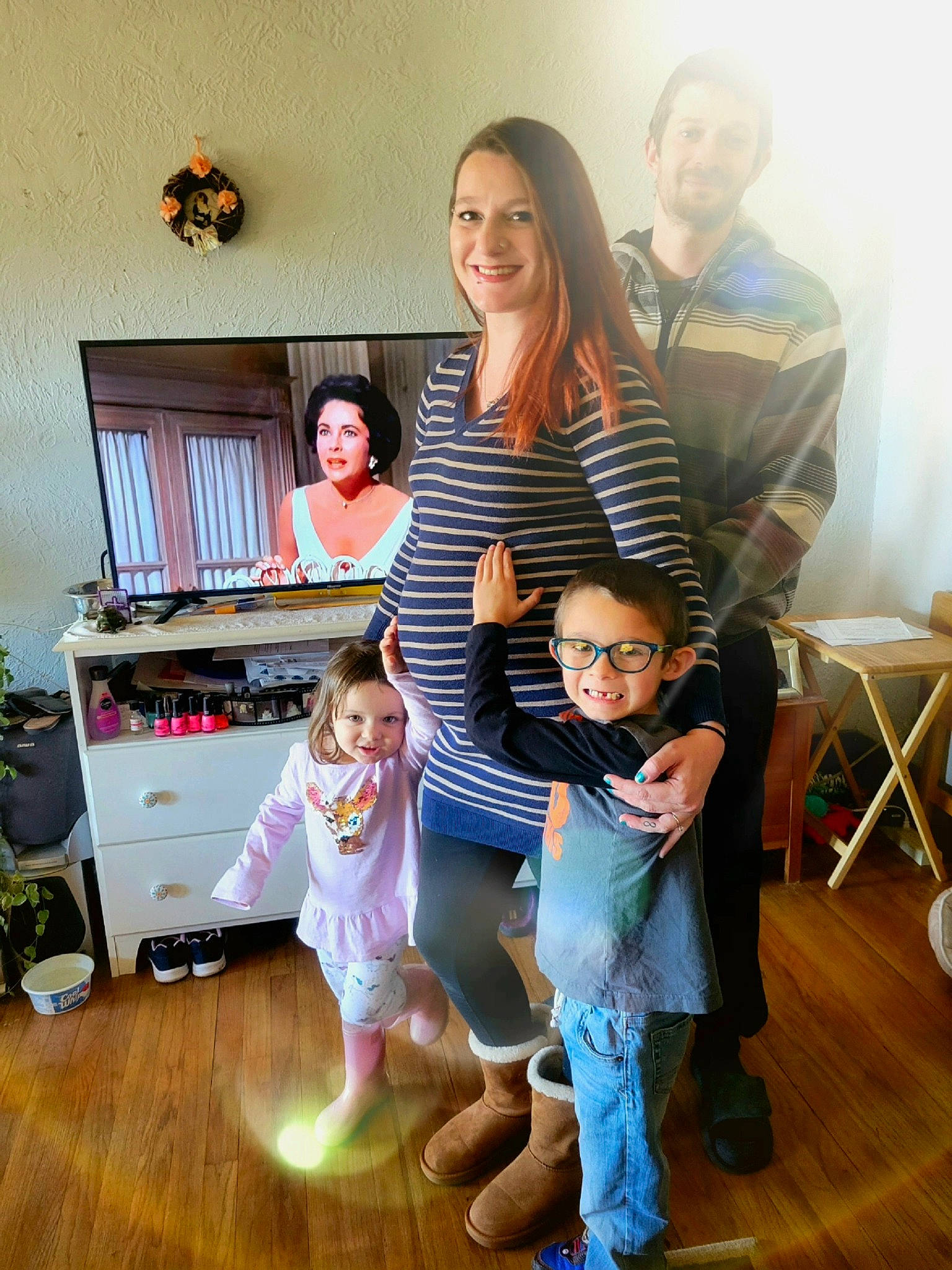 Rylin is registered to the contest to win money with this photo: chair, child, event, floor, flooring, fun, happy, hardwood, home, houseplant, jeans, joy, laminate_flooring, leisure, living_room, person, sitting, smile, t_shirt, toddler