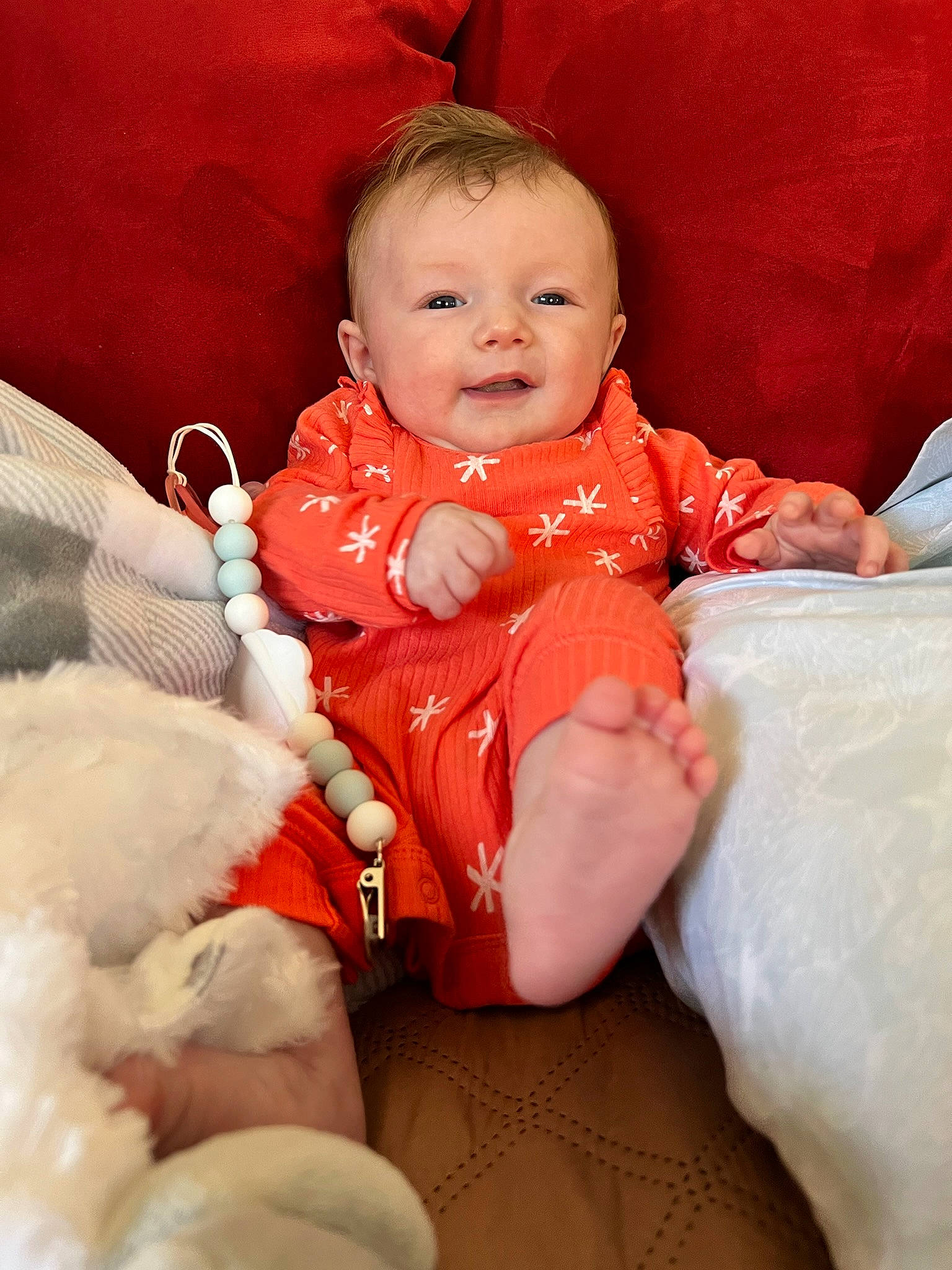 Madeleine joined the competition — help win amazing prizes! baby, baby_toddler_clothing, cheek, child, comfort, dress, face, finger, fun, happy, iris, linens, person, pink, red, sitting, skin, sleeve, smile, textile