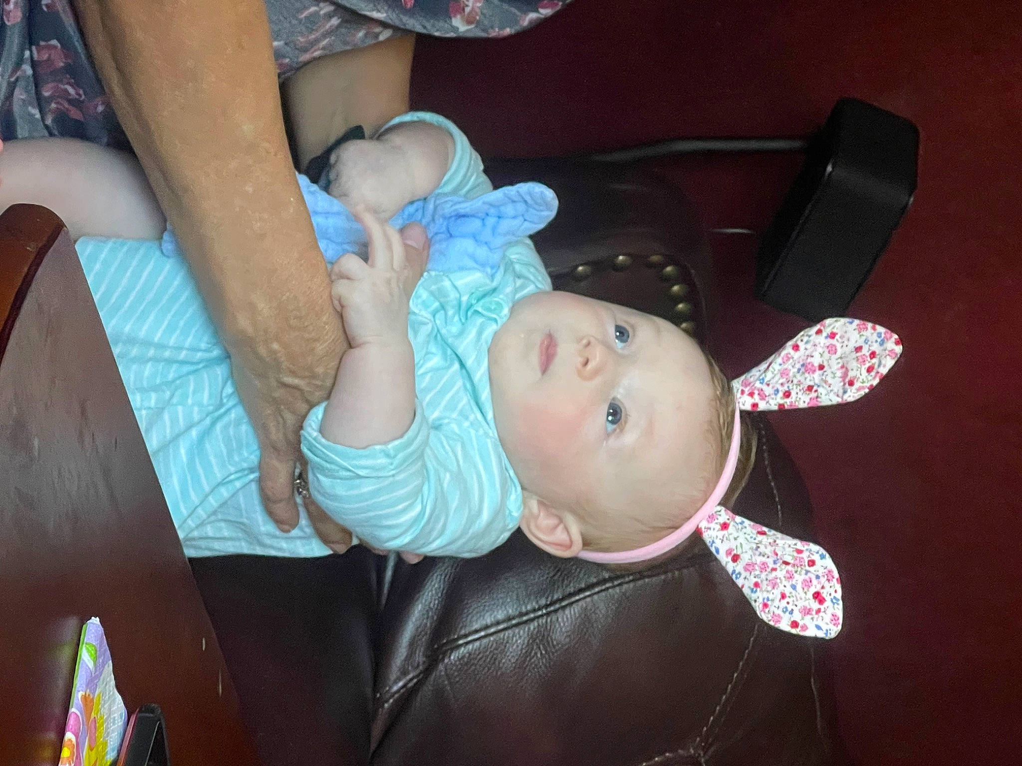 Madeleine is registered to the contest to win money with this photo: baby, baby_products, baby_toddler_clothing, cheek, child, elbow, fashion_accessory, fun, hairstyle, hat, human_leg, mouth, nail, person, room, thigh, thumb, toddler