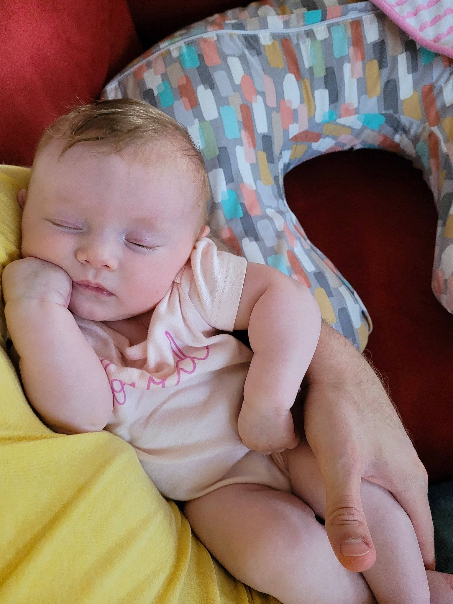 Madeleine is registered to the contest to win money with this photo: arm, baby, baby_toddler_clothing, cheek, comfort, eye, face, finger, hand, head, human_body, leg, organ, person, pink, skin, stomach, thigh, thumb, toddler