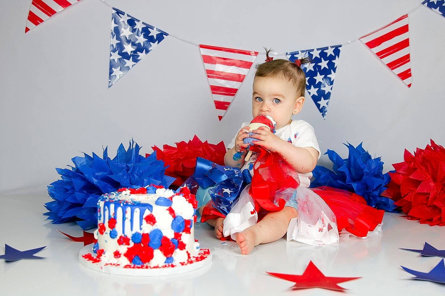 Dakota is registered to the contest to win money with this photo: baby_toddler_clothing, blue, carmine, christmas_eve, electric_blue, event, flag, flag_day_usa, flag_of_the_united_states, font, happy, holiday, paper_product, party_supply, person, petal, picture_frame, present, red, sugar_cake