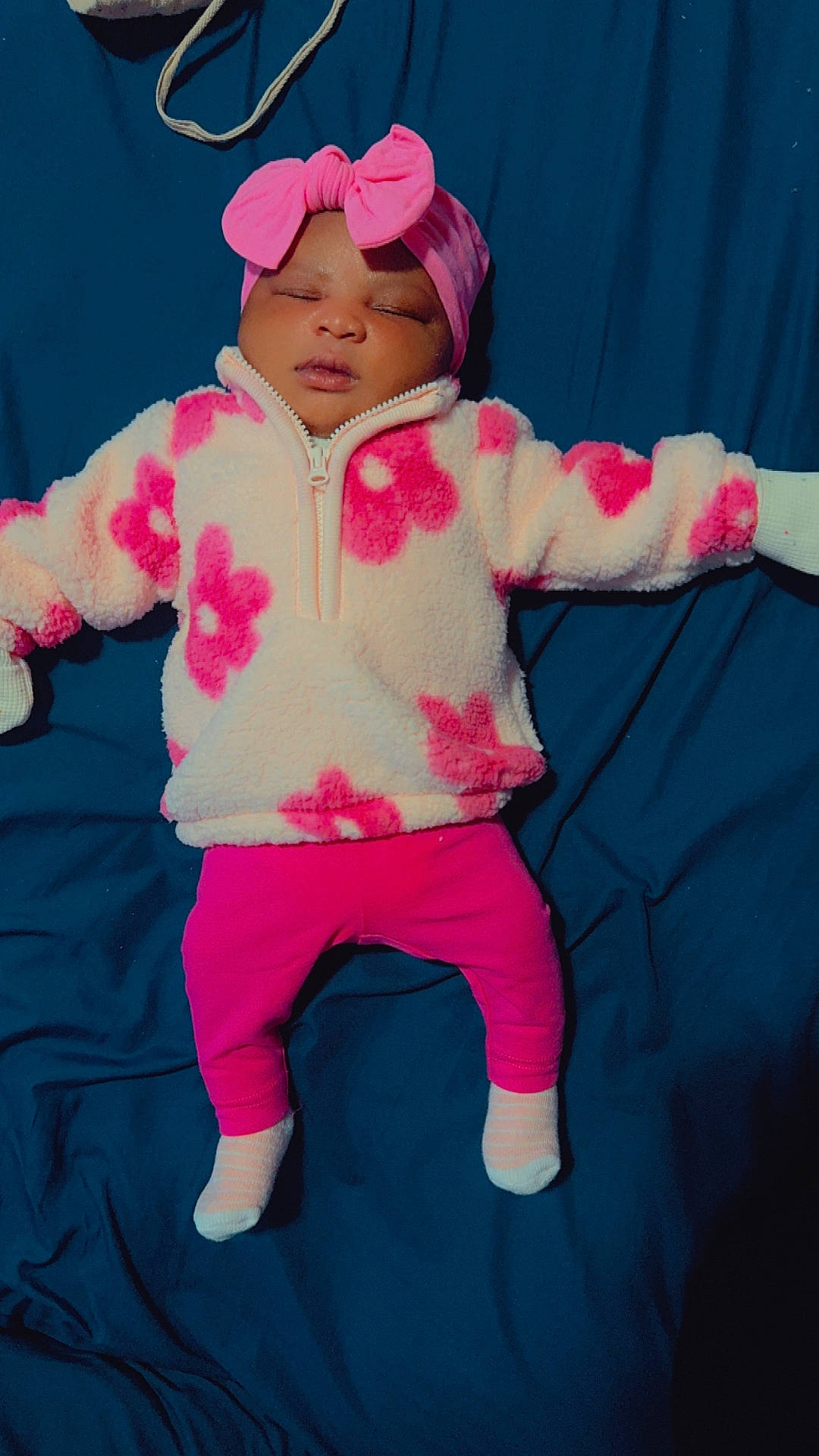 baby, bodypart, bonnet, cap, clothing, face, finger, hat, head, hood, hoodie, hosiery, knitwear, person, photography, portrait, purple, sock, sweater, sweatshirt