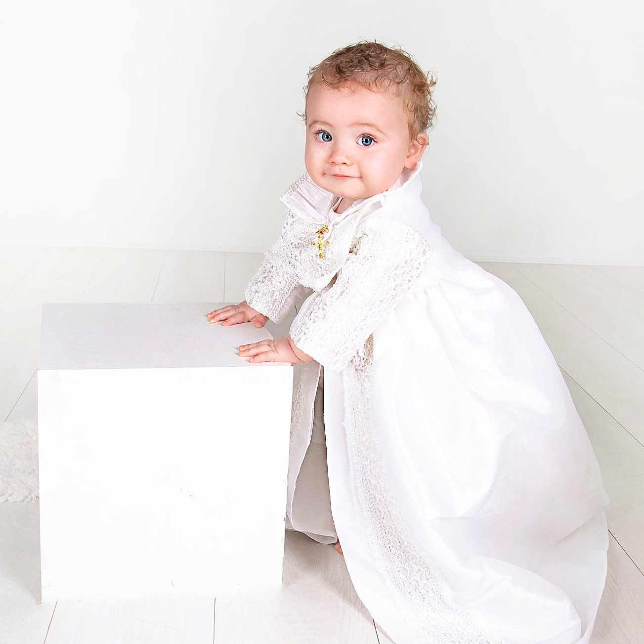 Theo is registered to the contest to win money with this photo: baby, box, clothing, dress, eveningdress, face, fashion, formalwear, furniture, gown, head, longsleeve, person, photography, portrait, sitting, sleeve, suit, wedding, weddinggown