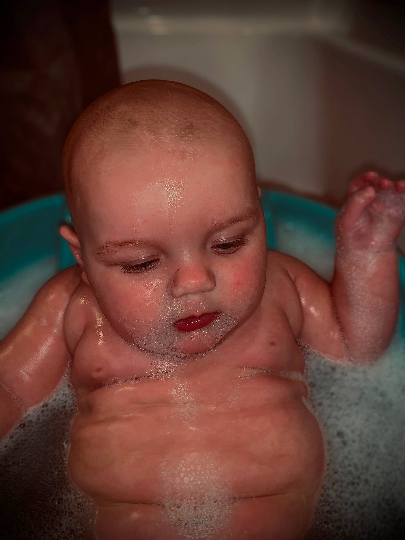 Brody is registered to the contest to win money with this photo: arm, baby_bathing, cheek, ear, eye, eyelash, fluid, forehead, hair, hand, human_body, jaw, joint, lip, liquid, mouth, neck, nose, person, skin