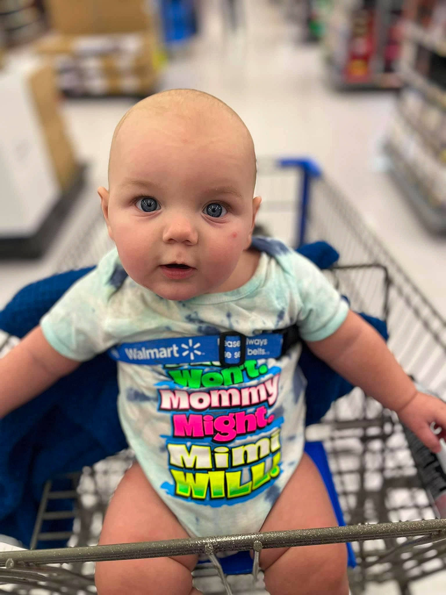 Brody is registered to the contest to win money with this photo: baby, baby_products, baby_toddler_clothing, chest, child, electric_blue, eye, fun, happy, leisure, person, product, service, shelf, shopping_cart, shorts, sitting, skin, t_shirt, thigh
