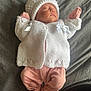 baby, newborn, sleeping, knit_hat, knit_sweater, pink_pajamas, blanket, soft_texture, infant, cute, peaceful, clothing, child, sleep, portrait, indoors, warm, cozy, rest, adorable