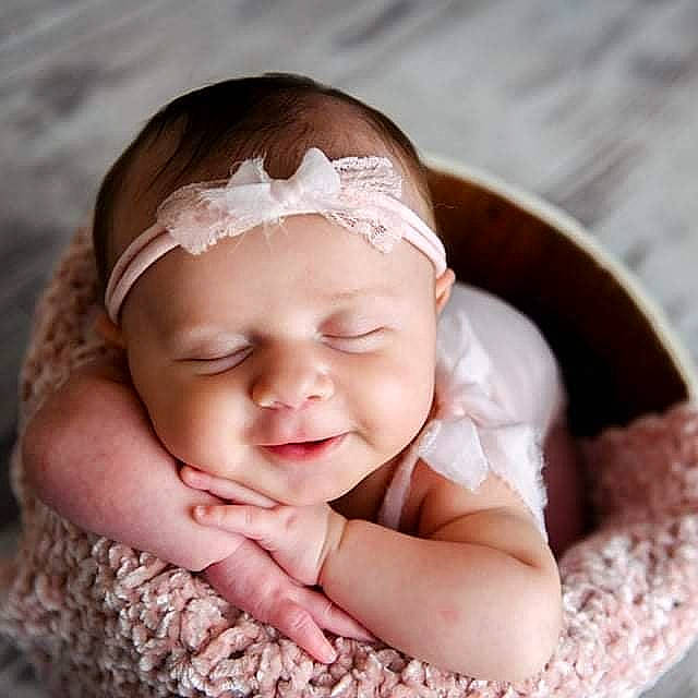 Jillian is registered to the contest to win money with this photo: baby, baby_toddler_clothing, cheek, clothing, comfort, eye, eyebrow, eyelash, face, finger, flash_photography, hair, happy, head, headwear, iris, lip, nose, person, pink