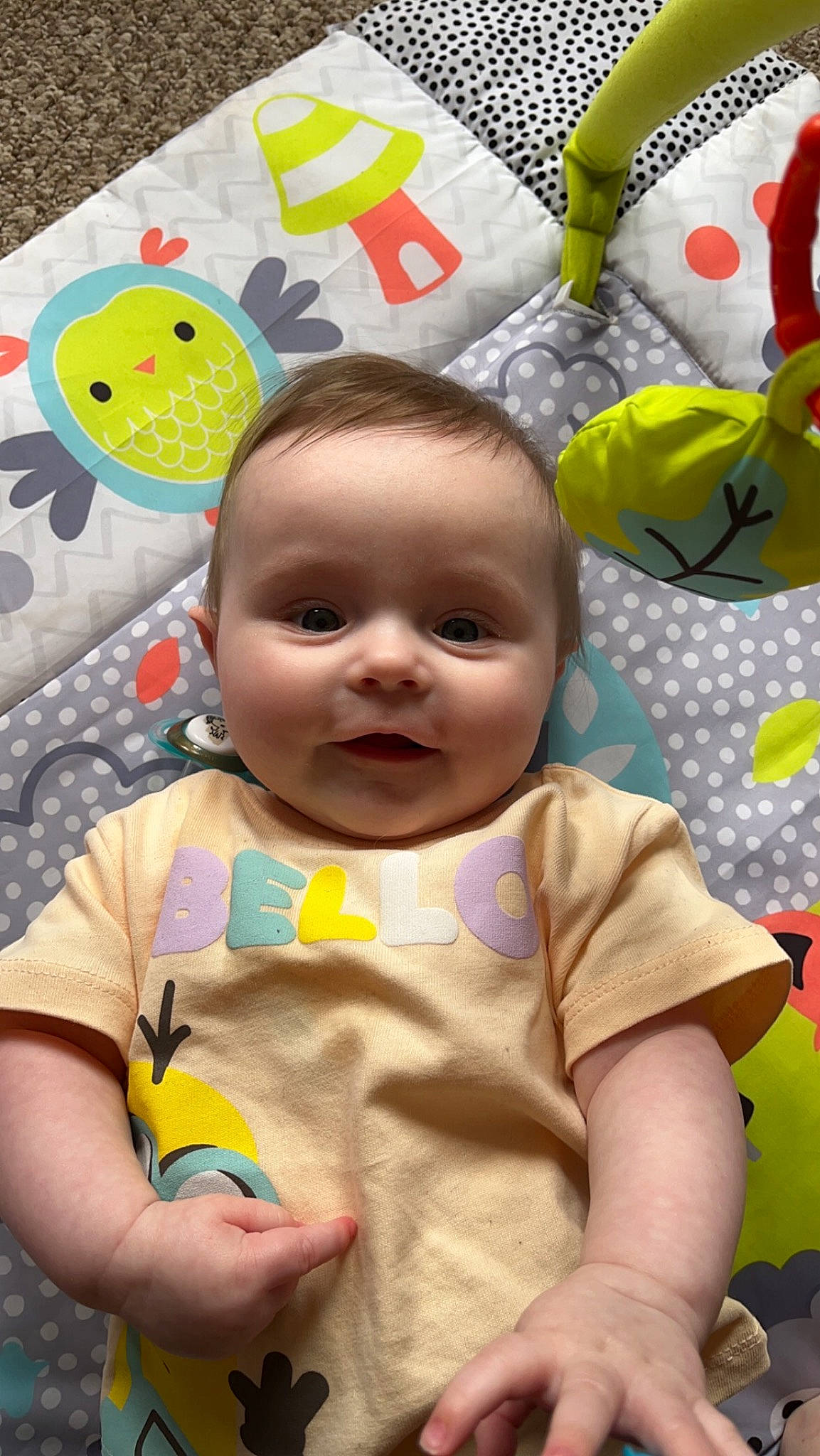 Casey is registered to the contest to win money with this photo: baby, baby_toddler_clothing, cheek, child, comfort, face, facial_expression, fun, happy, linens, pattern, person, play, skin, sleeve, smile, t_shirt, textile, toddler, white