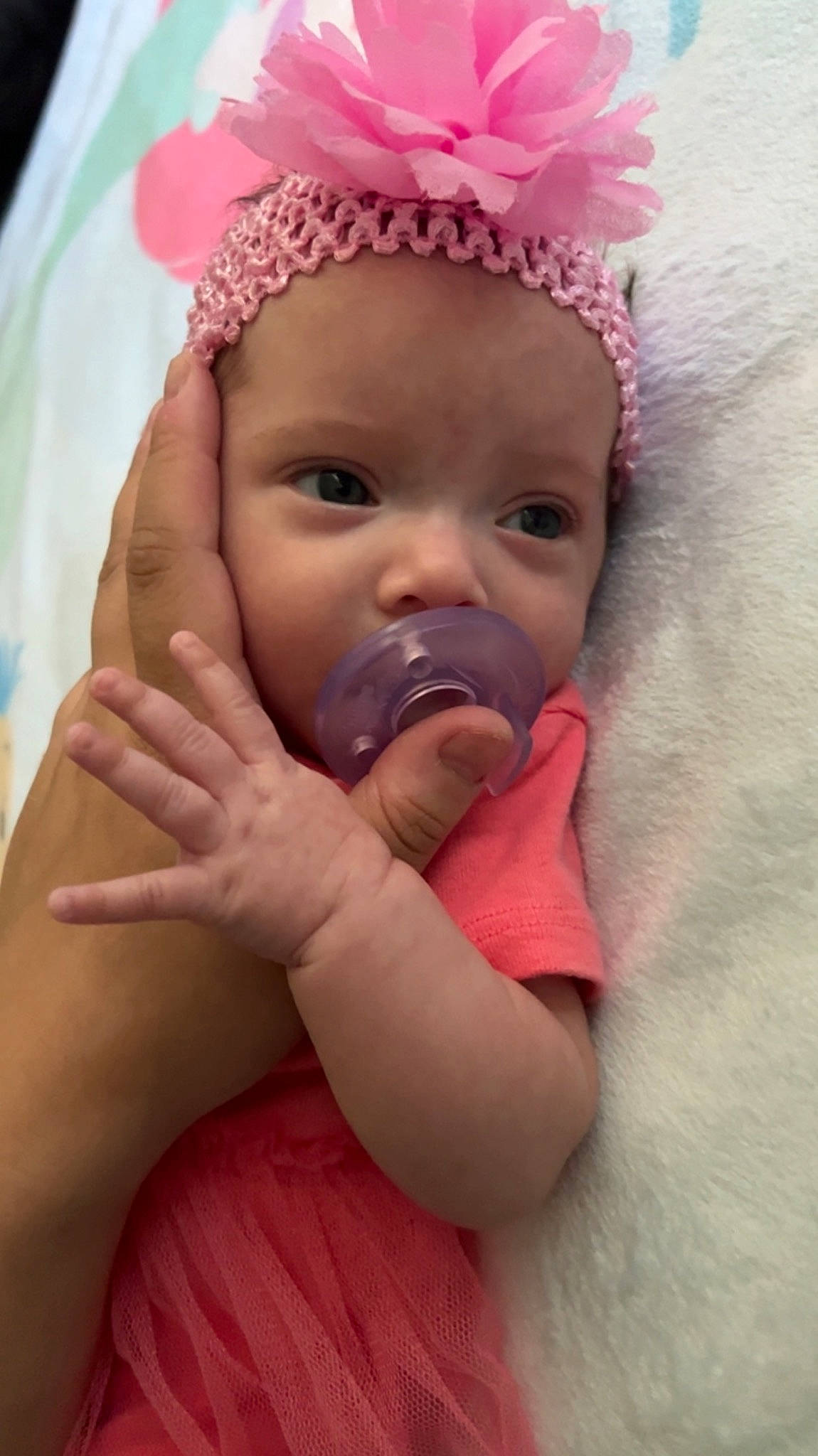 Ariel is registered to the contest to win money with this photo: baby, baby_toddler_clothing, cap, cheek, chin, eye, eyebrow, eyelash, face, finger, gesture, happy, head, headwear, iris, lip, mouth, nose, person, pink