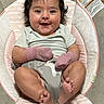 Olivia is registered to the contest to win money with this photo: baby, baby_seat, child, chubby, comfortable, cushion, cute, face, feet, hair, happy, indoors, infant, mittens, onesie, person, rosy_cheeks, smile, toes, unicorn