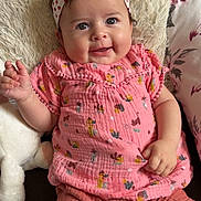 Avélina a rejoint le concours — aidez-le/la à gagner de superbes lots ! baby, child, cozy, cushion, cute, fabric, face, hand, happy, headband, indoor, infant, pillow, pink_clothing, plush_toy, portrait, seated, shorts, smiling, soft_texture