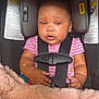 Autumn is registered to the contest to win money with this photo: baby, car_seat, infant, child, pink_clothing, bracelet, blanket, toy, seatbelt, face, looking, indoors, sitting, cute, small_hand, safety, head_support, expression, straps, soft_texture