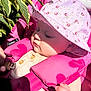 baby, child, pink, hat, sunhat, floral, leaves, sunlight, shadow, hand, face, outdoor, nature, seatbelt, harness, clothing, cute, infant, closeup, portrait