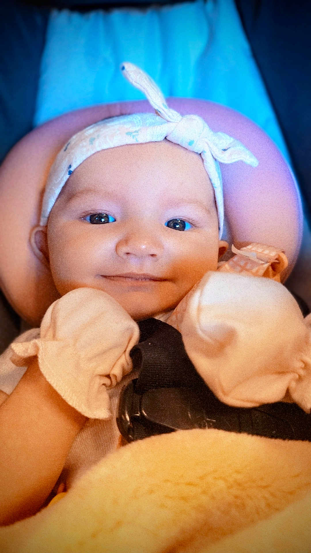 Koralisa is registered to the contest to win money with this photo: baby, infant, headband, mittens, blanket, smile, face, closeup, child, cute, soft, cozy, warm, portrait, young, indoors, happy, comfortable, person, head