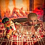 baby, tub, metal, string_lights, candy_canes, gingerbread_plush, fireplace, blanket, red, green, holiday, christmas, cozy, infant, cute, warm, decor, smile, indoor, festive