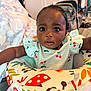 Wynter joined the competition — help win amazing prizes! baby, baby_seat, bed, blanket, cherry, child, clothing, colorful, curious, cute, expression, eyes, face, furniture, indoor, infant, pattern, person, portrait, skin