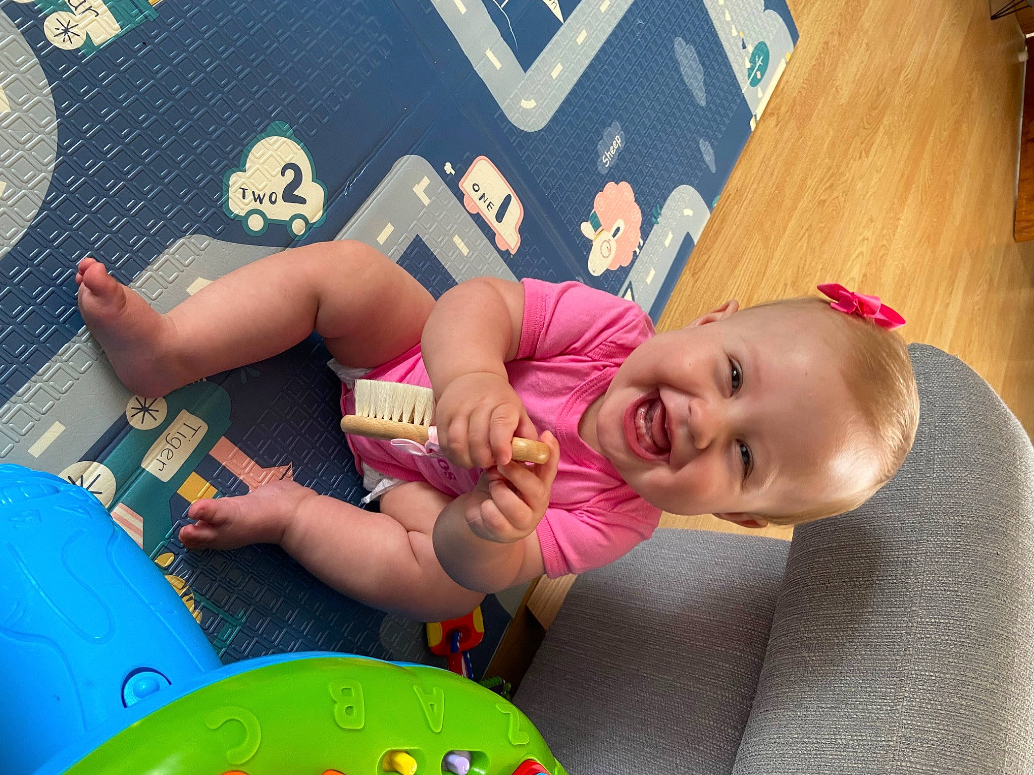 Edie joined the competition — help win amazing prizes! baby, baby_playing_with_toys, baby_products, child, facial_expression, flooring, fun, happy, human_leg, leisure, mouth, pattern, person, play, recreation, room, smile, snapshot, thigh, toddler
