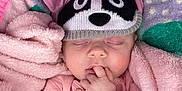 Kameryn Jo is registered to the contest to win money with this photo: apparel, baby, child, closed_eyes, cozy, cute, finger_in_mouth, hand, headwear, infant, panda_hat, pastel_colors, peaceful, pink_blanket, plush, portrait, sleeping, soft_texture, toddler, wrapped