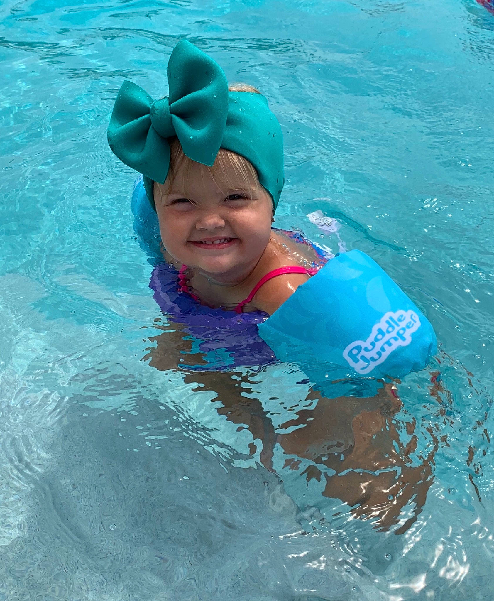 Ailie is registered to the contest to win money with this photo: cap, child, fun, headgear, individual_sports, joy, leisure, leisure_centre, person, personal_protective_equipment, recreation, smile, swim_cap, swimmer, swimming, swimming_pool, vacation, water
