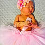 baby, bodypart, clothing, costume, dancing, dress, face, finger, flower, flowerarrangement, flowerbouquet, hand, head, leisureactivities, newborn, person, petal, photography, plant, portrait