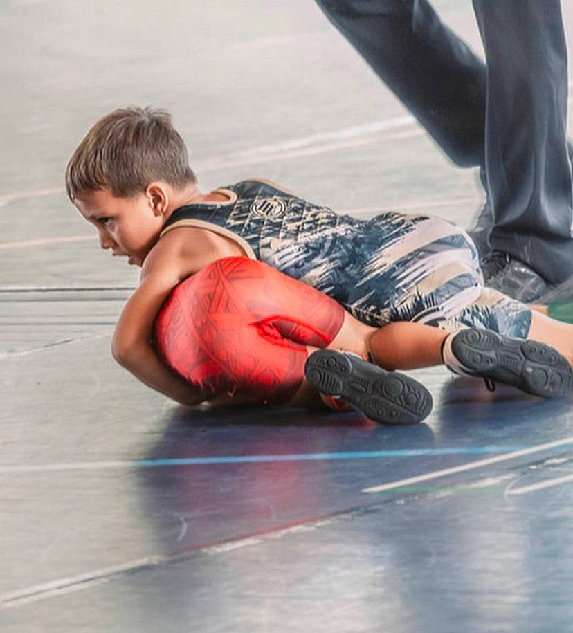 Ikaika is registered to the contest to win money with this photo: asphalt, elbow, entertainment, event, exercise, floor, flooring, foot, fun, human_body, human_leg, joint, knee, leisure, performing_arts, person, recreation, shorts, sportswear, thigh