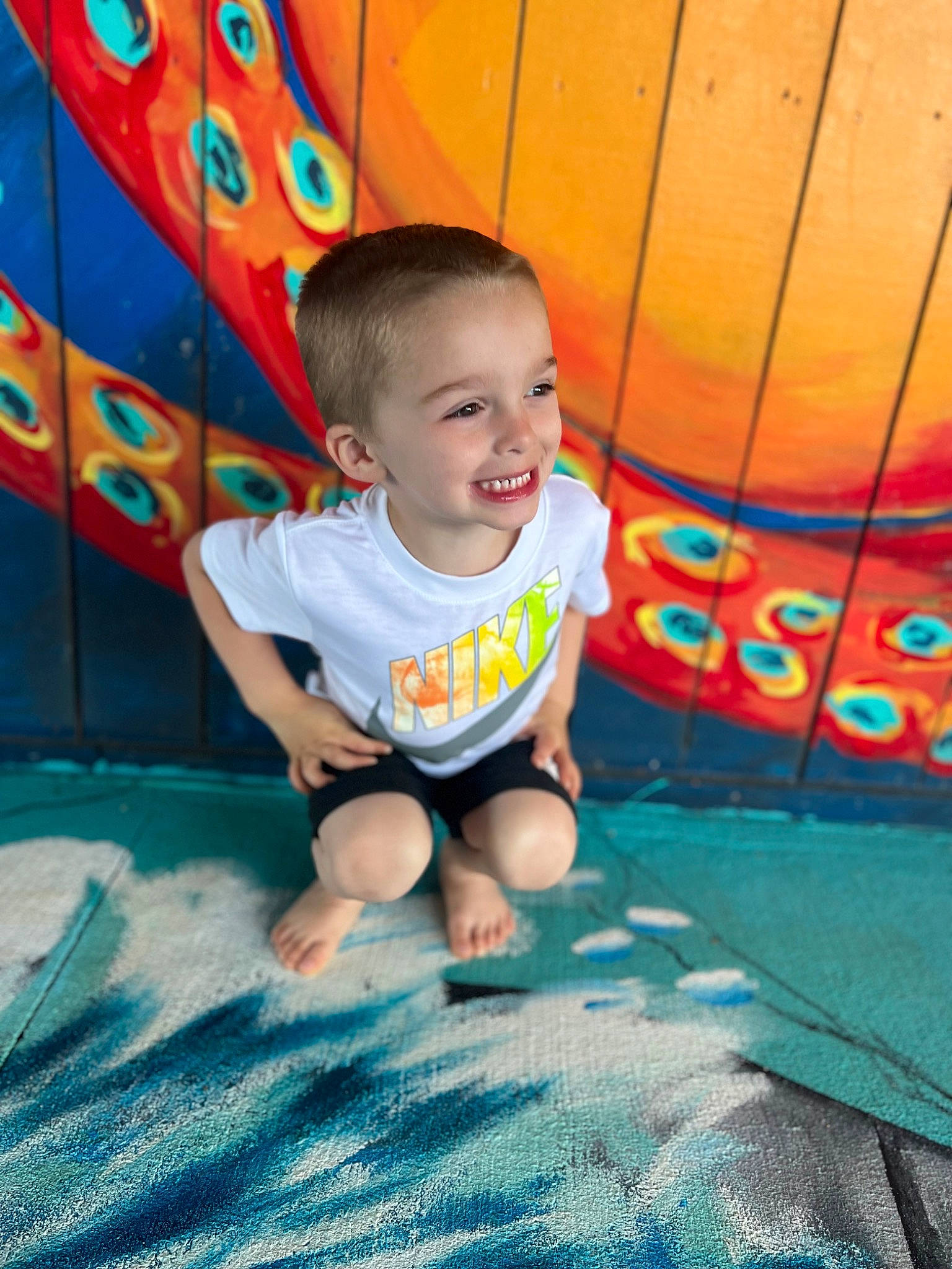 Antonio joined the competition — help win amazing prizes! baby_toddler_clothing, blue, child, city, flooring, fun, grass, happy, human_leg, joy, leaf, leisure, outdoor_play_equipment, person, playground, recreation, shorts, sitting, smile, summer
