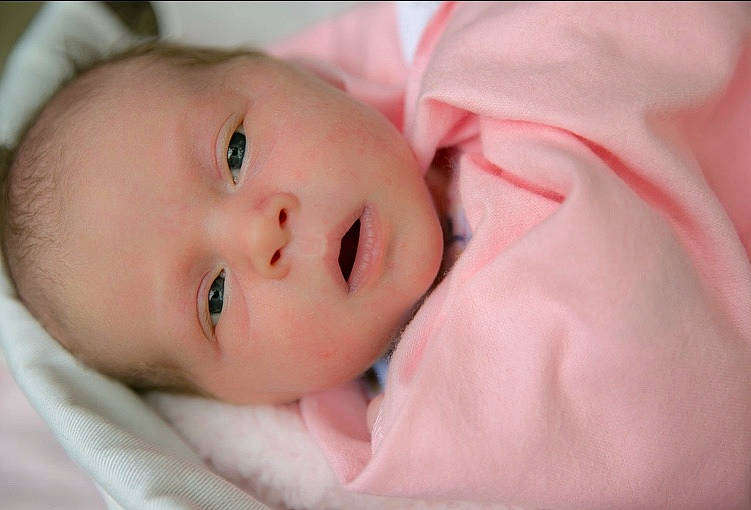 Kora is registered to the contest to win money with this photo: baby, beauty, bedtime, cheek, child, chin, close_up, ear, eye, face, head, iris, lip, mouth, nose, person, photography, pink, portrait_photography, skin