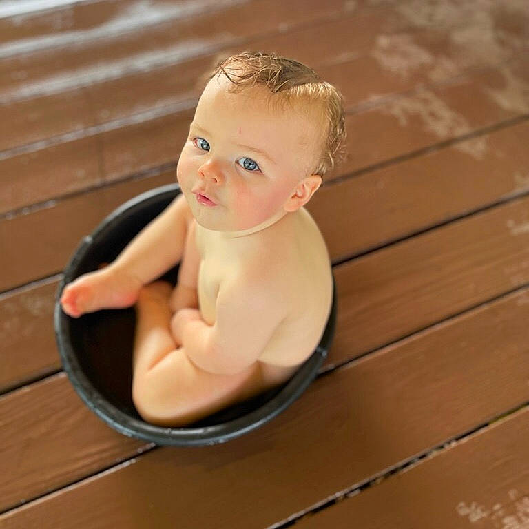 Greysen joined the competition — help win amazing prizes! baby, baby_products, baby_toddler_clothing, bathing, cheek, chest, child, flooring, foot, happy, hardwood, human_body, jewellery, metal, person, sitting, stomach, thumb, toddler, wood