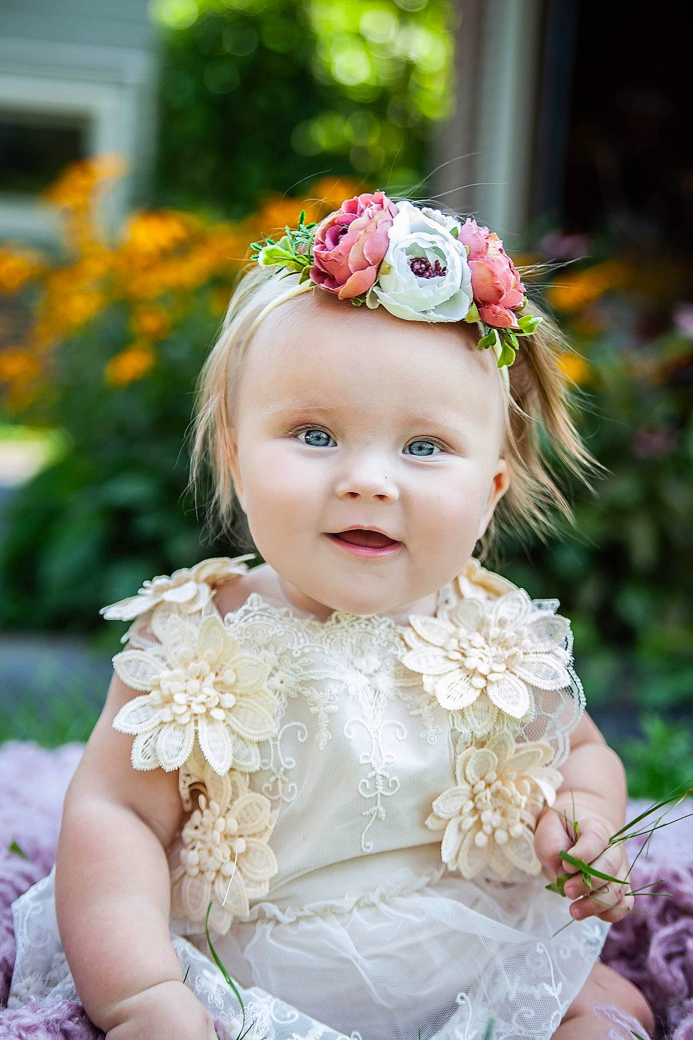 Lucy joined the competition — help win amazing prizes! baby, baby_toddler_clothing, botany, dress, face, flash_photography, flower, grass, hairstyle, happy, headgear, headpiece, iris, person, petal, photograph, pink, plant, skin, smile