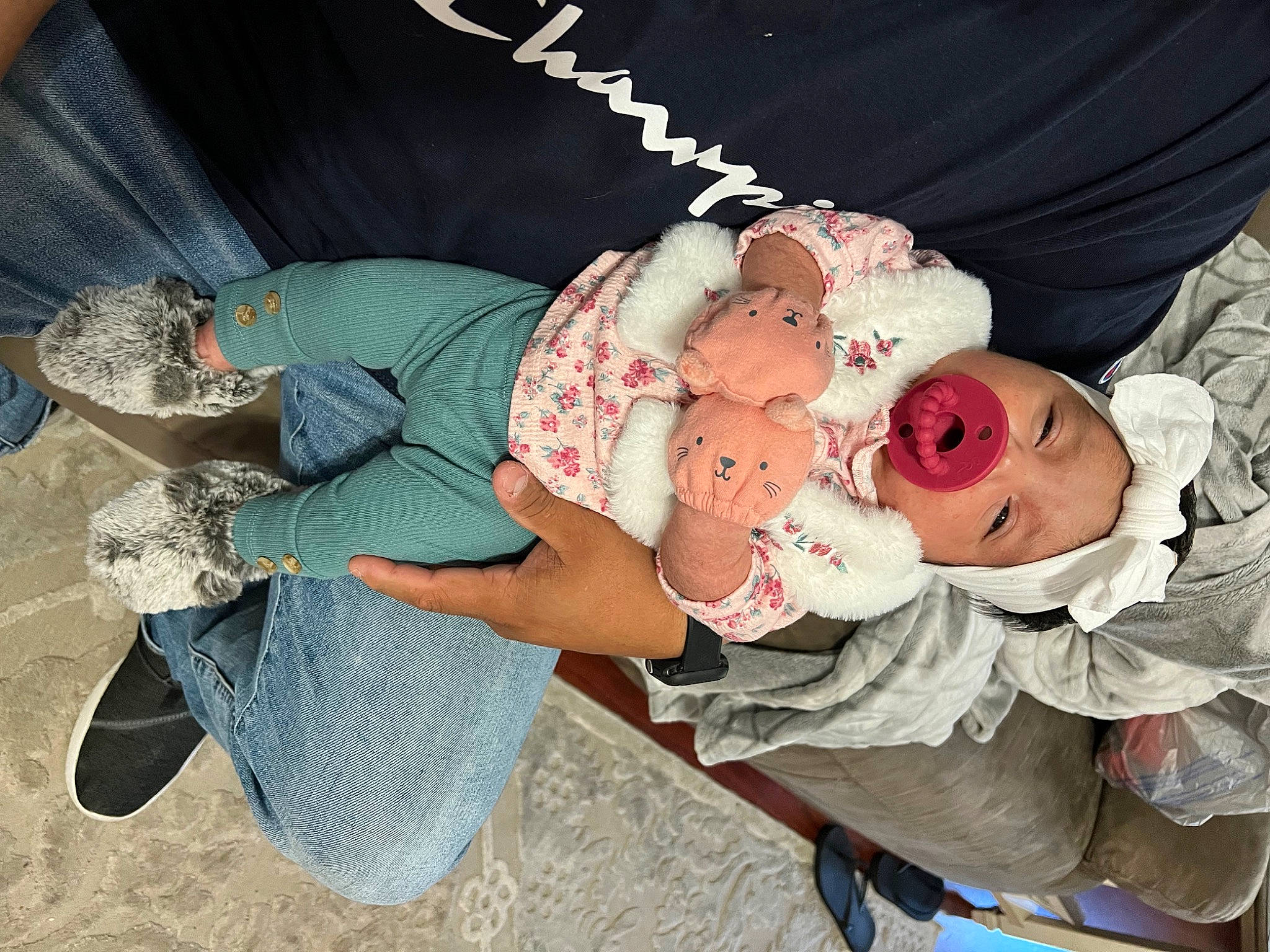 Everleigh is registered to the contest to win money with this photo: arm, baby, baby_products, baby_toddler_clothing, child, comfort, finger, fun, hand, happy, hat, headgear, headwear, human_body, leg, pattern, person, pink, product, rose