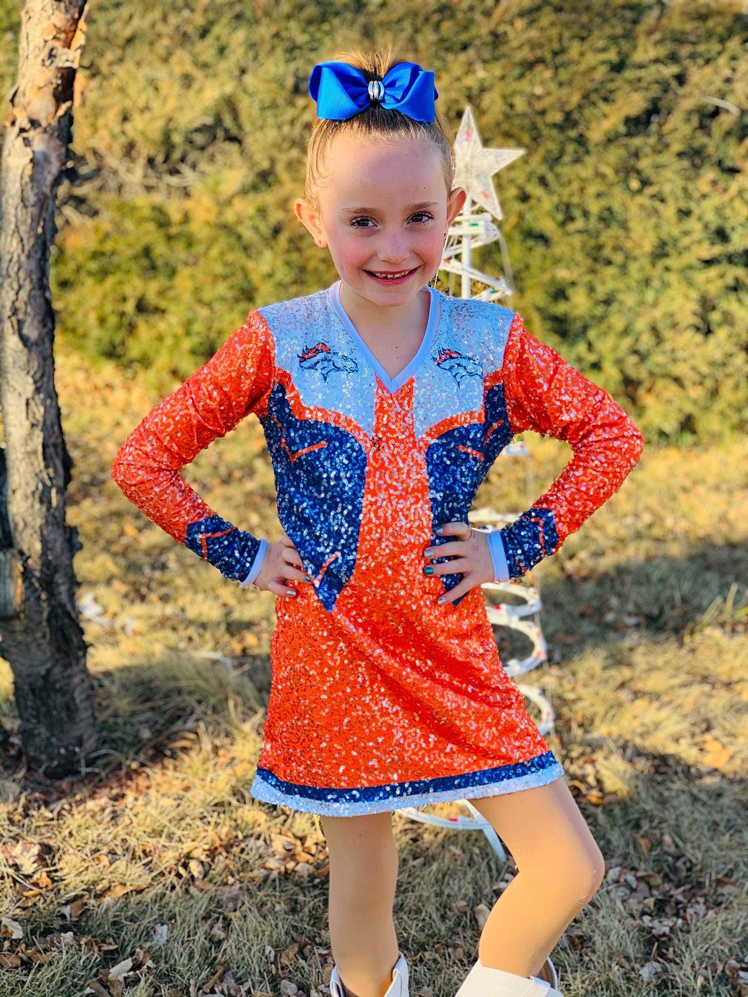Faithlyn is registered to the contest to win money with this photo: blue, child, child_model, clothing, costume, design, dress, electric_blue, joy, majorette_dancer, outerwear, pattern, person, sleeve, smile, toddler, uniform, yellow