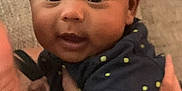 Grayson is registered to the contest to win money with this photo: baby, cheeks, child, clothing, cute, expression, eyebrows, face, hands, head, holding, human, indoor, infant, person, portrait, skin, smile, toddler, young