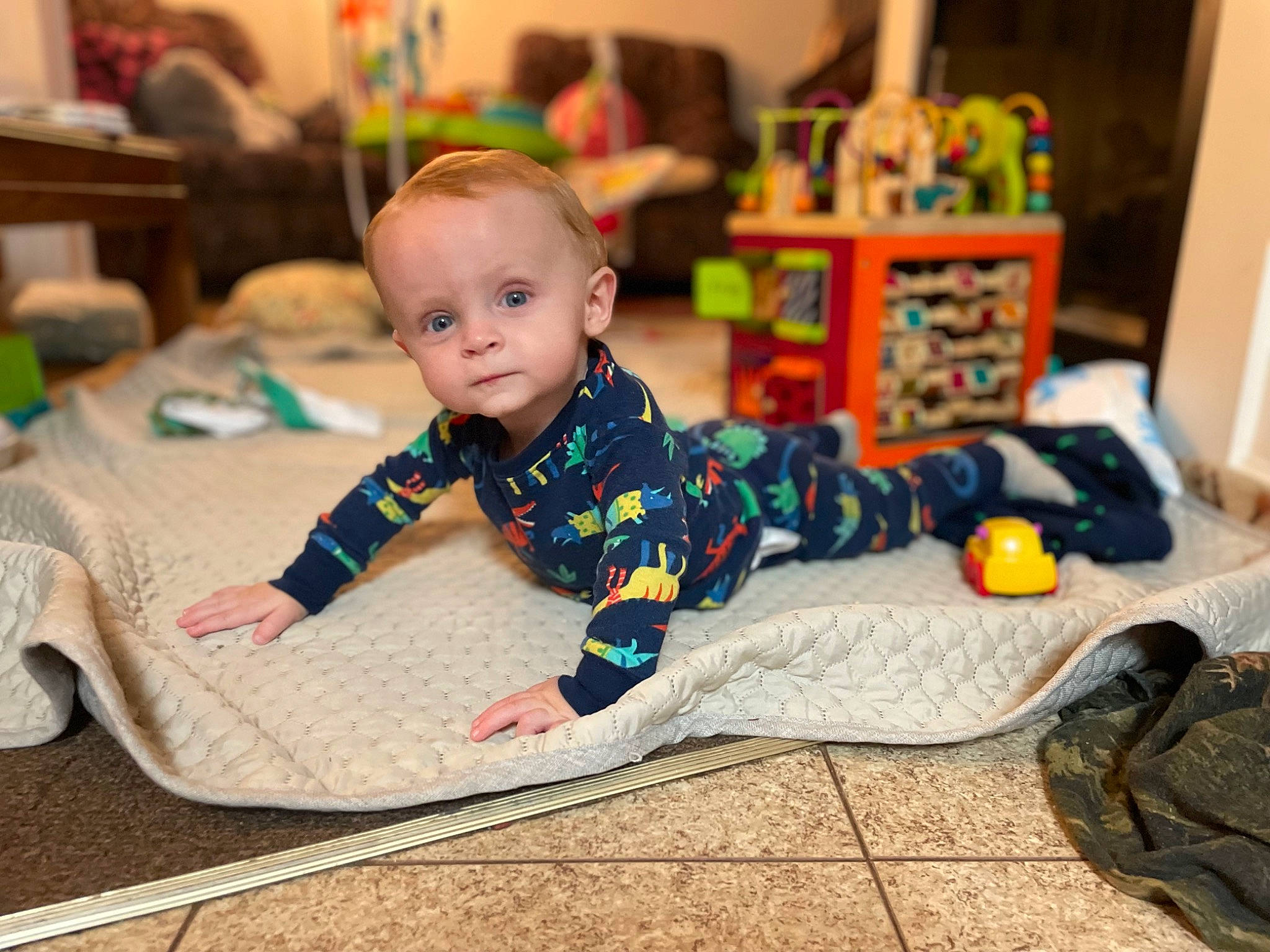 Jaiden is registered to the contest to win money with this photo: baby, baby_toddler_clothing, carpet, chair, child, comfort, crawling, floor, flooring, fun, happy, hardwood, head, pattern, person, play, room, sitting, smile, toddler